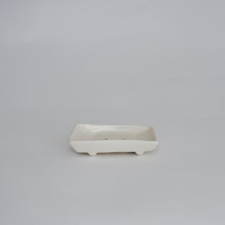 White ceramic dish on a gray background